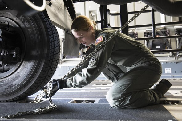 U.S. Air Force Airman 1st Class Lauren Sheppard, assigned to the 535th Airlift Squadron as a C-17 loadmaster, secures a tie-down chain on a Japan Air Self-Defense Force (JASDF) Electric Power Plant vehicle Nov. 6, 2016 at Yokota Air Base, Japan, during exercise Keen Sword 2017. Units from the U.S. military conduct training with Japan Self-Defense Forces counterparts at military installations throughout Japan, the Mariana Islands and in the surrounding waters. All participating units train in a comprehensive scenario that is designed to practice the critical capabilities and interoperability required to support the defense of Japan, and to respond to a potential crisis or contingency in the Indo-Asia-Pacific region. (U.S. Air Force photo by Yasuo Osakabe/Released)