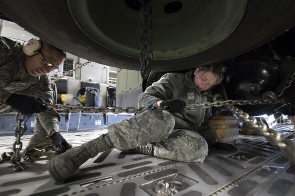 (Right to left) U.S. Air Force Airmen 1st Class Ashley Dennis and Galdamez Moran, both assigned to the 730th Air Mobility Squadron as air freight technicians, secure a tie-down chain on a Japan Air Self-Defense Force (JASDF) Electric Power Plant vehicle Nov. 6, 2016 at Yokota Air Base, Japan, during exercise Keen Sword 2017. Units from the U.S. military conduct training with JASDF counterparts at military installations throughout Japan, the Mariana Islands and in the surrounding waters. All participating units train in a comprehensive scenario that is designed to practice the critical capabilities and interoperability required to support the defense of Japan, and to respond to a potential crisis or contingency in the Indo-Asia-Pacific region. (U.S. Air Force photo by Yasuo Osakabe/Released) 