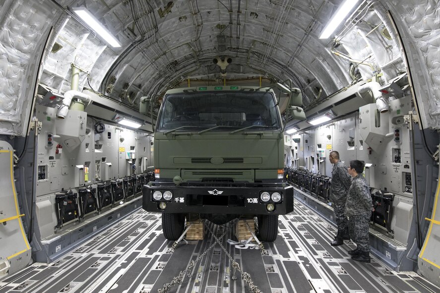 Japan Air Self-Defense Force members watch their Electric Power Plant vehicle after completing a tie-down at Yokota Air Base, Japan, Nov. 6, 2016, during the Keen Sword 2017. This is the first time the vehicle loading onto a C-17. Units from the U.S. military conduct training with Japan Self-Defense Forces counterparts at military installations throughout Japan, the Mariana Islands and in the surrounding waters. All participating units train in a comprehensive scenario that is designed to practice the critical capabilities and interoperability required to support the defense of Japan, and to respond to a potential crisis or contingency in the Indo-Asia-Pacific region. (U.S. Air Force photo by Yasuo Osakabe/Released) 