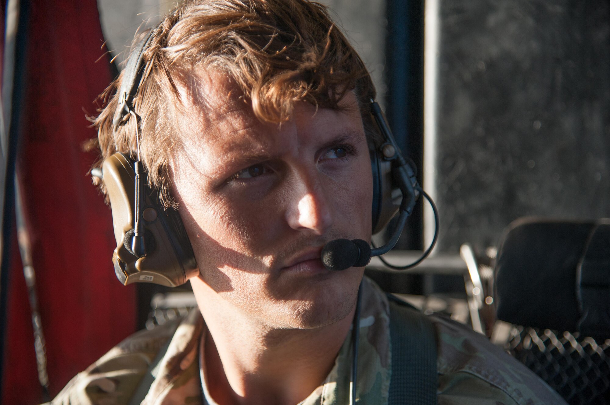 Staff Sgt. Caleb Williams, 18th Operations Support Squadron SERE specialist, performs a communications check aboard a HH-60G Pave Hawk helicopter assigned to the 33rd Rescue Squadron for exercise Keen Sword Nov. 4, 2016, off the coast of Okinawa, Japan. During the training, members of the 33rd RQS practiced recovery operations for a simulated downed pilot in a hostile environment. (U.S. Air Force photo by Senior Airman John Linzmeier)