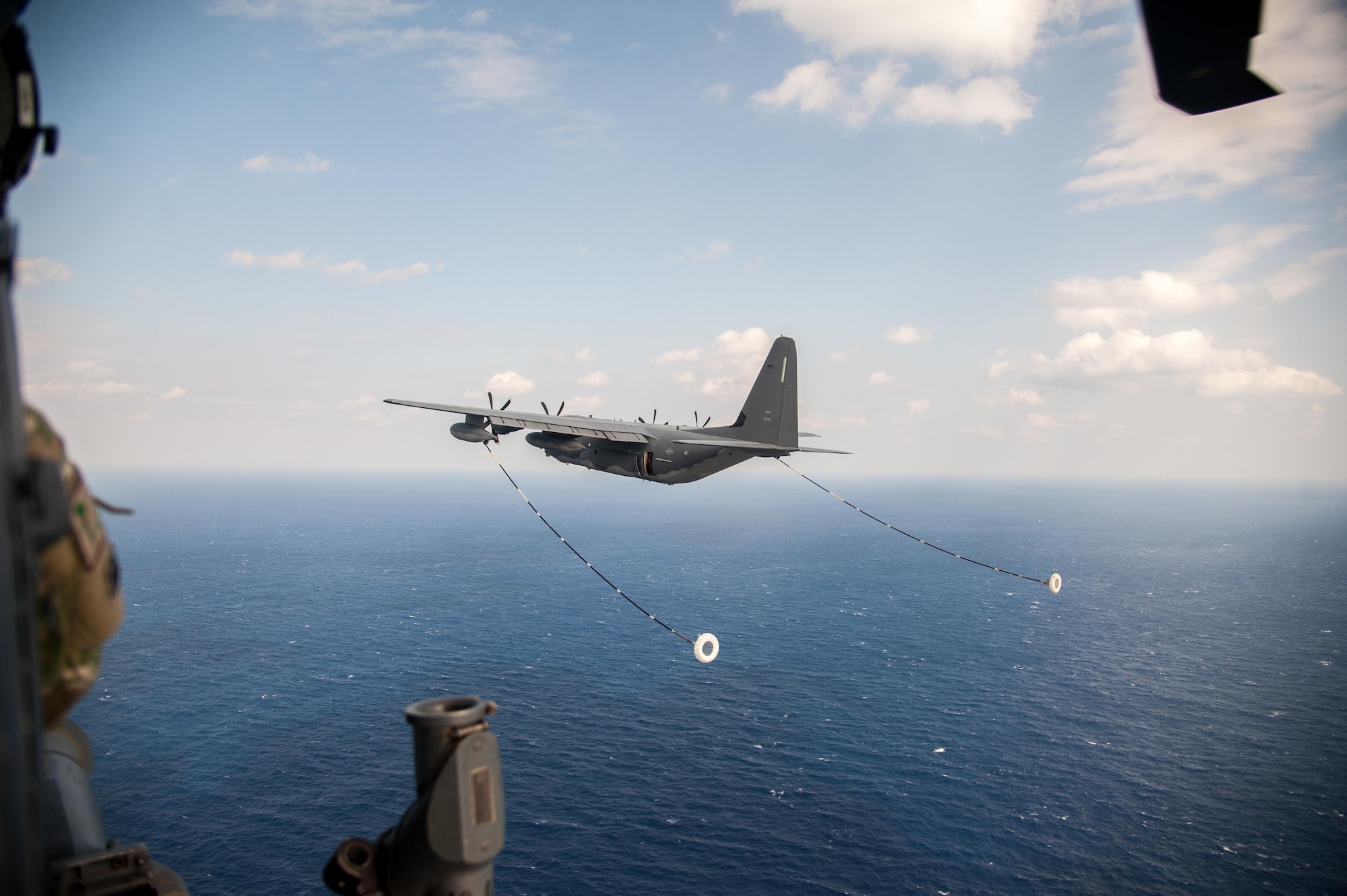 A U.S. Air Force MC-130J Commando II from the 17th Special Operations Squadron prepares to perform in-flight refueling with a HH-60G Pave Hawk helicopter assigned to the 33rd Rescue Squadron Nov. 4, 2016, off the coast of Okinawa, Japan. Keen Sword is a regularly scheduled exercise which strengthens Japan-U.S. military interoperability and meets mutual defense objectives. Japan-U.S. military operations and exercises increase readiness to respond to varied crisis situations in the region. (U.S. Air Force photo by Senior Airman John Linzmeier)