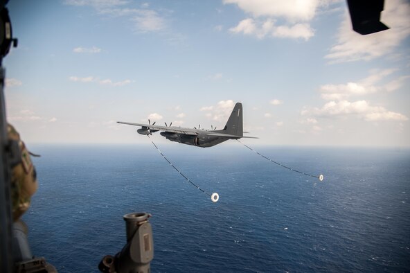 A U.S. Air Force MC-130J Commando II assigned to the 17th Special Operations Squadron prepares to perform in-flight refueling with a HH-60G Pave Hawk helicopter assigned to the 33rd Rescue Squadron Nov. 4, 2016, near Okinawa, Japan, during exercise Keen Sword (KS) 17. KS 17  is a regularly scheduled exercise which strengthens U.S.-Japan military interoperability and meets mutual defense objectives.  (U.S. Air Force photo by Senior Airman John Linzmeier)