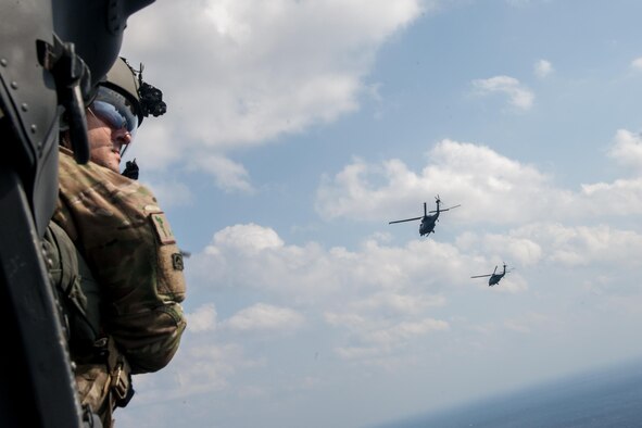 U.S. Air Force Master Sgt. Vincent Hnat, assigned to the 33rd Rescue Squadron (RQS) as a special mission aviator, scans his surroundings aboard a HH-60G Pave Hawk helicopter Nov. 4, 2016, near Okinawa, Japan during exercise Keen Sword 17. During the exercise, combat rescue teams train to increase the interoperability required to support the defense of Japan, respond to a potential crisis and offer humanitarian assistance. (U.S. Air Force photo by Senior Airman John Linzmeier)