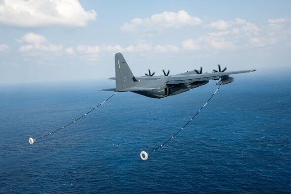 A U.S. Air Force MC-130J Commando II assigned to the 17th Special Operations Squadron prepares to perform in-flight refueling with a HH-60G Pave Hawk helicopter assigned to the 33rd Rescue Squadron Nov. 4, 2016, off the coast of near Okinawa, Japan, during exercise Keen Sword 17. The fundamental role of U.S. forces in Japan is to deter aggression and maintain peace and security in the region, and is an essential component of the U.S.-Japan alliance. (U.S. Air Force photo by Senior Airman John Linzmeier)