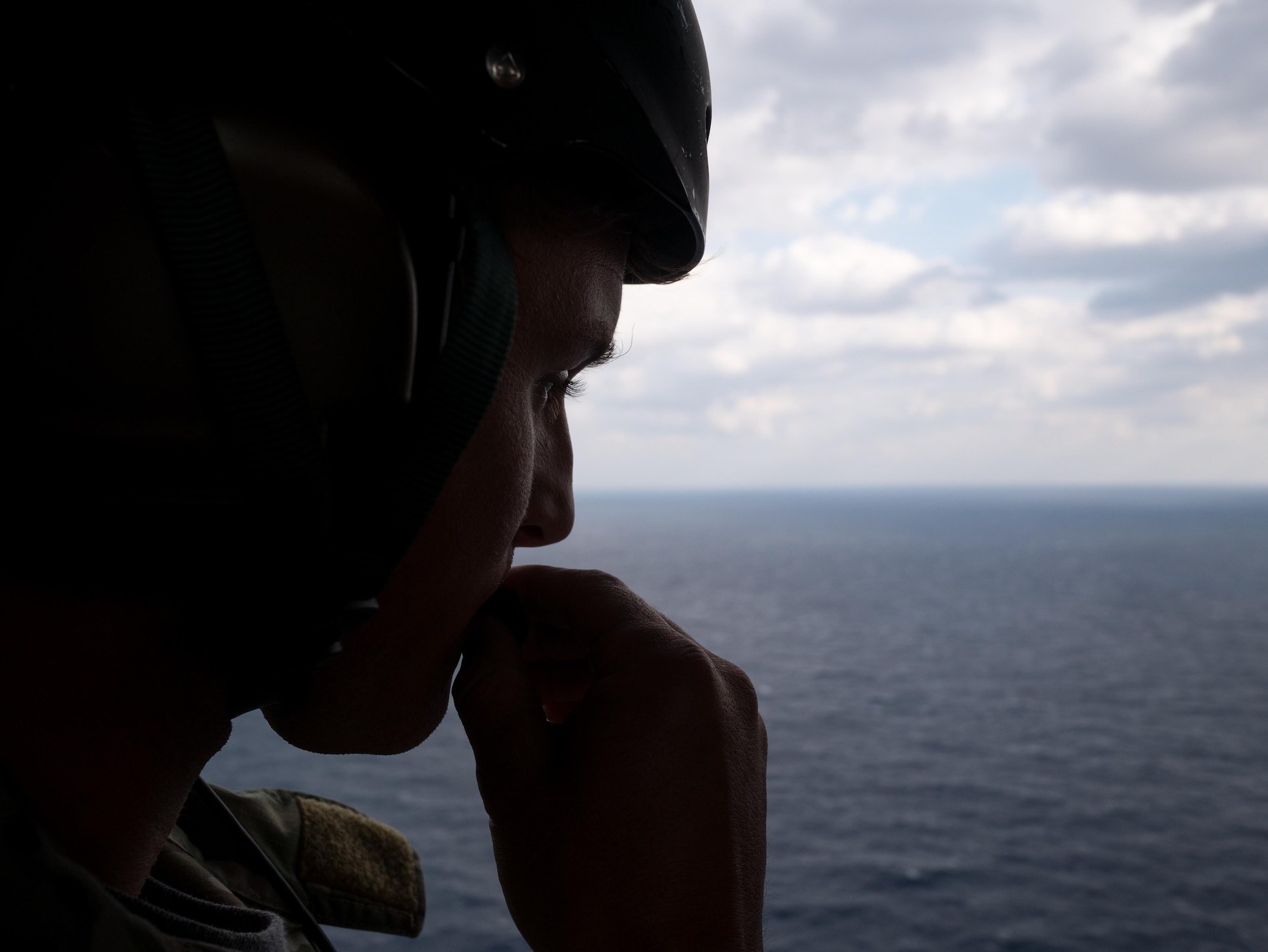Staff Sgt. Caleb Williams, 18th Operations Support Squadron SERE specialist, performs a communications check aboard a HH-60G Pave Hawk helicopter assigned to the 33rd Rescue Squadron for exercise Keen Sword Nov. 4, 2016, off the coast of Okinawa, Japan. During the exercise, combat rescue teams train to increase the interoperability required to support the defense of Japan, respond to a potential crisis and offer humanitarian assistance.