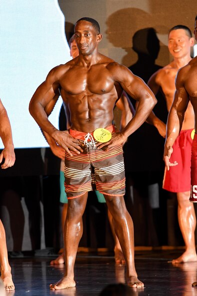 U.S. Air Force Tech. Sgt. Quinton Beach, 51st Munitions Squadron munitions control section chief, poses during the 2016 Mustang Mania Bodybuilding Competition on Osan Air Base, Republic of Korea, Nov. 5, 2016. Beach won the male physique 5’11” and below category during the competition. (U.S. Air Force photo by Staff Sgt. Jonathan Steffen)