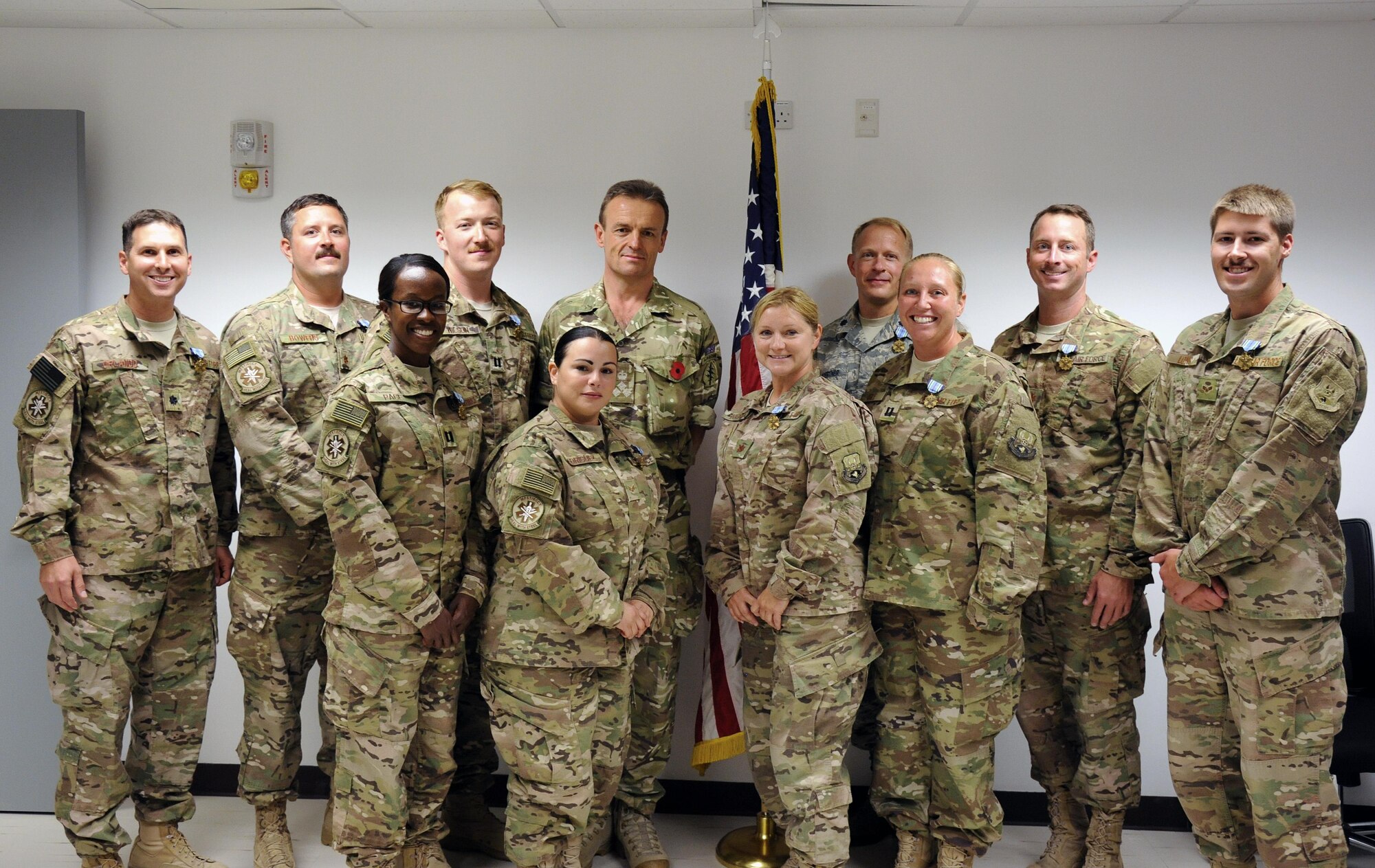 The mobile field surgical team assigned to the 379th Expeditionary Medical Operations Squadron pose for a group photo after being presented the Joint Service Achievement Medal Nov. 2, 2016, at Al Udeid Air Base, Qatar. These mobile field surgical team Airmen provided medical care for U.S. special operations forces supporting coalition forces and enhanced their unit’s ability to conduct operations in Syria. (U.S. Air Force photo by Senior Airman Cynthia A. Innocenti)