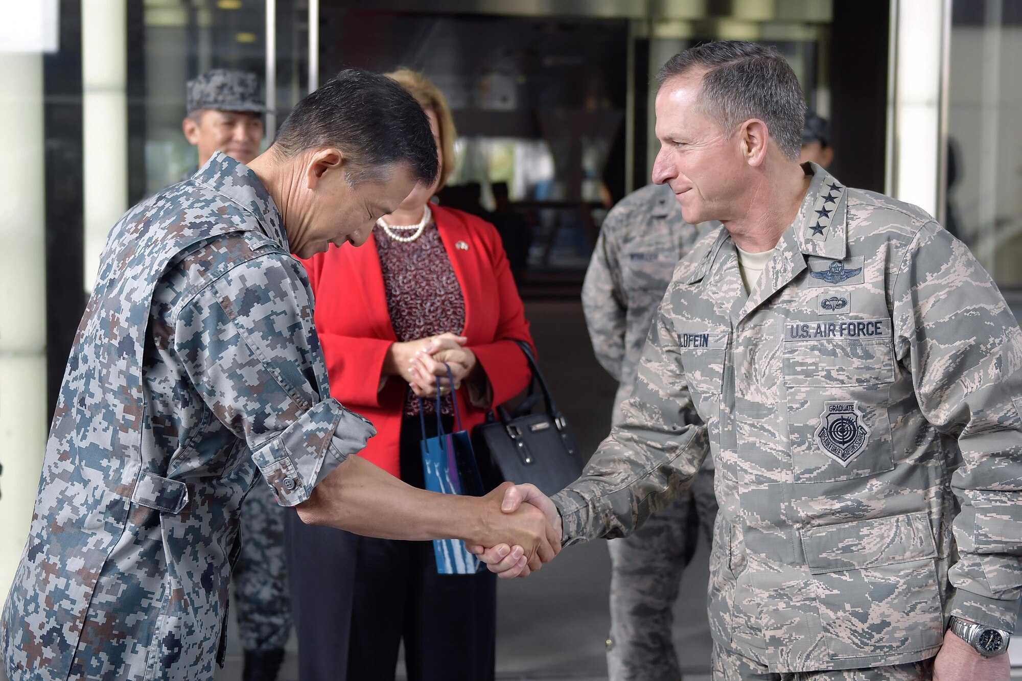 Air Force Chief of Staff Gen. David L. Goldfein shakes hands with Japan Air Self-Defense Force Air Defense Command Commander Lt. Gen. Hiroaki Fukue at Yokota Air Base, Japan, Nov. 8, 2016. Goldfein visited Yokota during an immersion tour of the Indo-Asia Pacific Region after becoming the 21st Air Force chief of staff in July 2016. (U.S. Air Force photo by Senior Airman Delano Scott/Released)