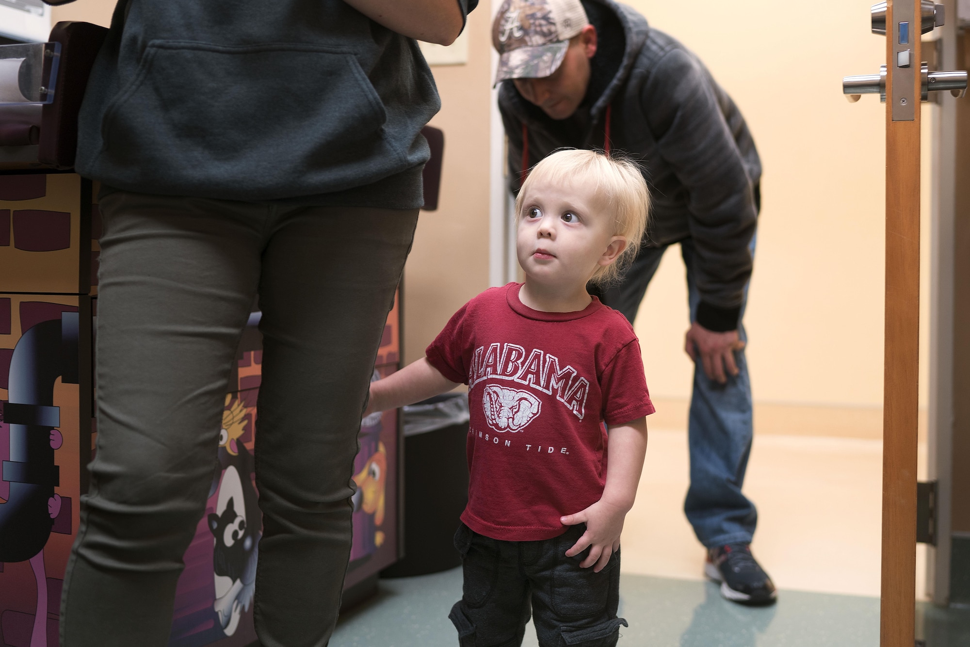 A patient enters the 374th Medical Group pediatric clinic Nov. 2, 2016, at Yokota Air Base, Japan. The clinic's physicians and nurse practitioners conduct regular checkups, school physicals and take appointments for seasonal illnesses like influenza and allergies. (U.S. Air Force photo by Senior Airman Delano Scott/Released)