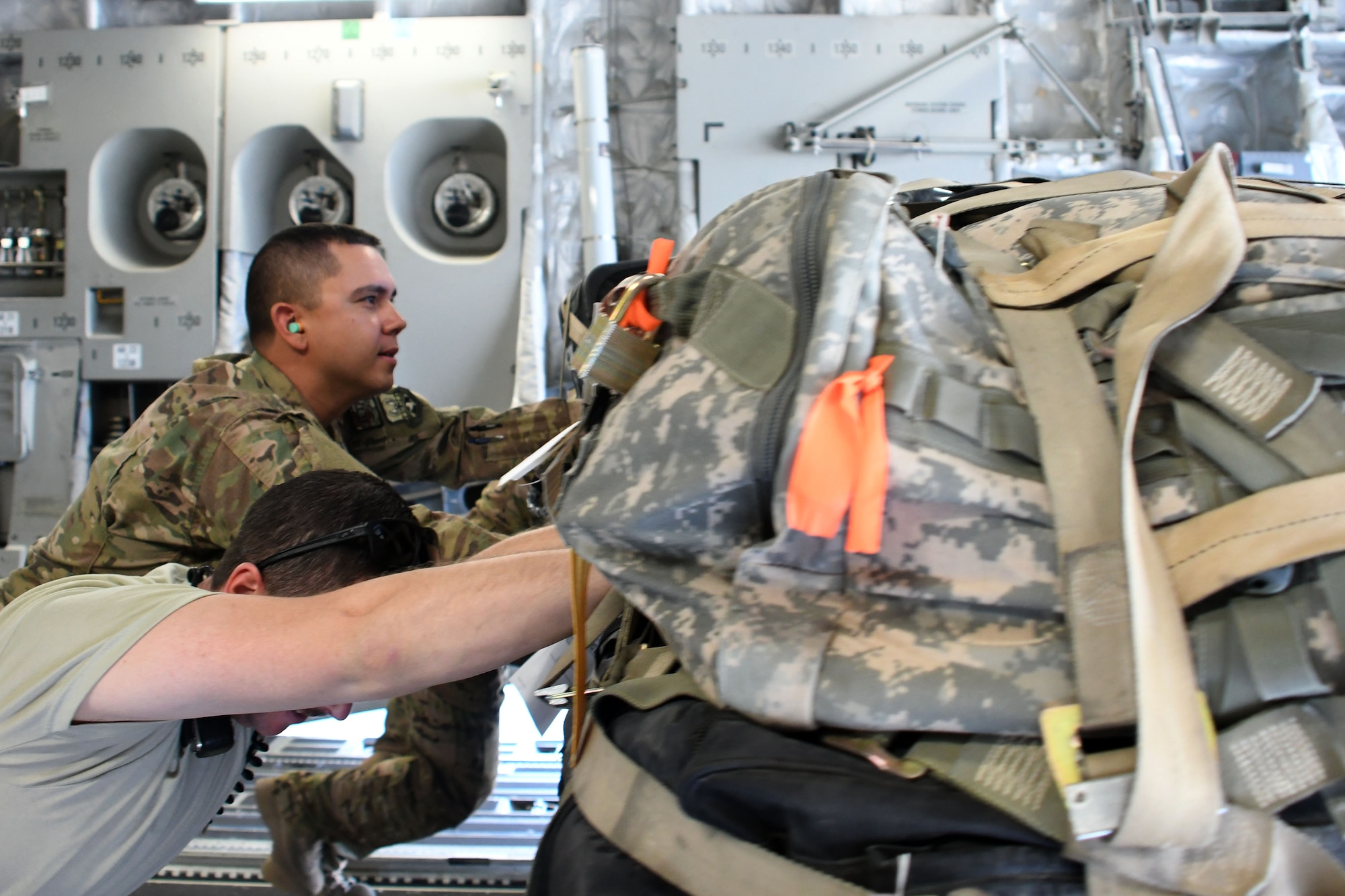 Tech Sgt. Ronald Gowen, a logistician assigned to the 387th Air Expeditionary Squadron, assists aerial porters with unloading a C-17 Globemaster III at an undisclosed location in Southwest Asia Nov. 4, 2016. Gowen is currently embedded with  the 386th Expeditionary Logistics Readiness Squadron as he awaits transfer to a joint unit. (U.S. Air Force photo/Senior Airman Andrew Park)