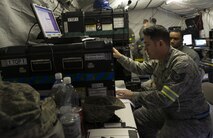 Tech. Sgt. James Higashiyama, 1st Combat Communications Squadron NCO in charge of radio frequency transmission systems, loads a configuration for a satellite dish during exercise Healthy Thunder at Ramstein Air Base, Germany, Oct. 27, 2016. The purpose of the two-week exercise was to provide 1st CBCS Airmen with hands-on training to prepare them for deployed situations. (U.S. Air Force photo by Senior Airman Tryphena Mayhugh)