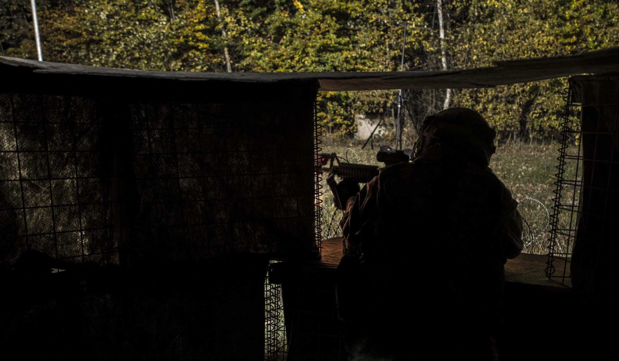 Senior Airman Markeith Davis, 1st Combat Communications Squadron radio frequency transmission systems technician, fires blanks from an M-16 rifle during exercise Healthy Thunder at Ramstein Air Base, Germany, Nov. 3, 2016. During the field training exercise portion of Healthy Thunder, Airmen defended a base from opposing forces. (U.S. Air Force photo by Senior Airman Tryphena Mayhugh)
