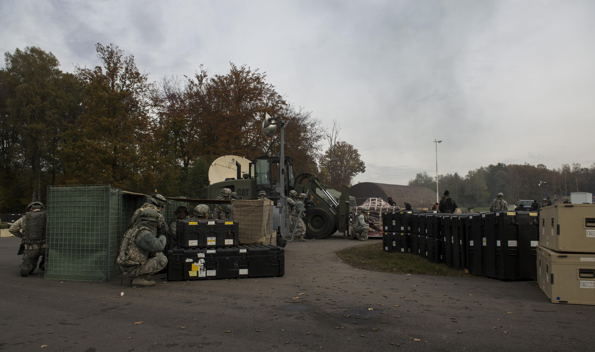 Airmen assigned to the 1st Combat Communications Squadron defend a base against opposing forces during exercise Healthy Thunder at Ramstein Air Base, Germany, Nov. 4, 2016. The purpose of the exercise was to prepare 1st CBCS Airmen for deployed situations. (U.S. Air Force photo by Senior Airman Tryphena Mayhugh)