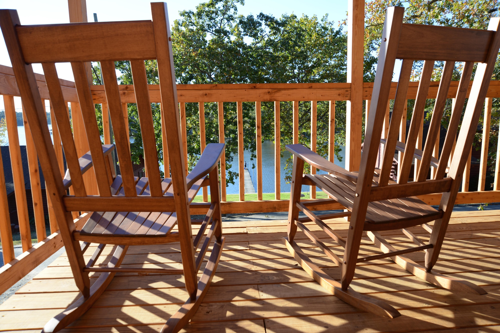 Rocking chairs sit on the porch of a new cabin at Wateree Recreation Area near Camden, S.C., Nov. 4, 2016. The facility’s new cabins offer guests outdoor porch seating with a view of the lake. (U.S. Air Force photo by Airman 1st Class Kathryn R.C. Reaves)