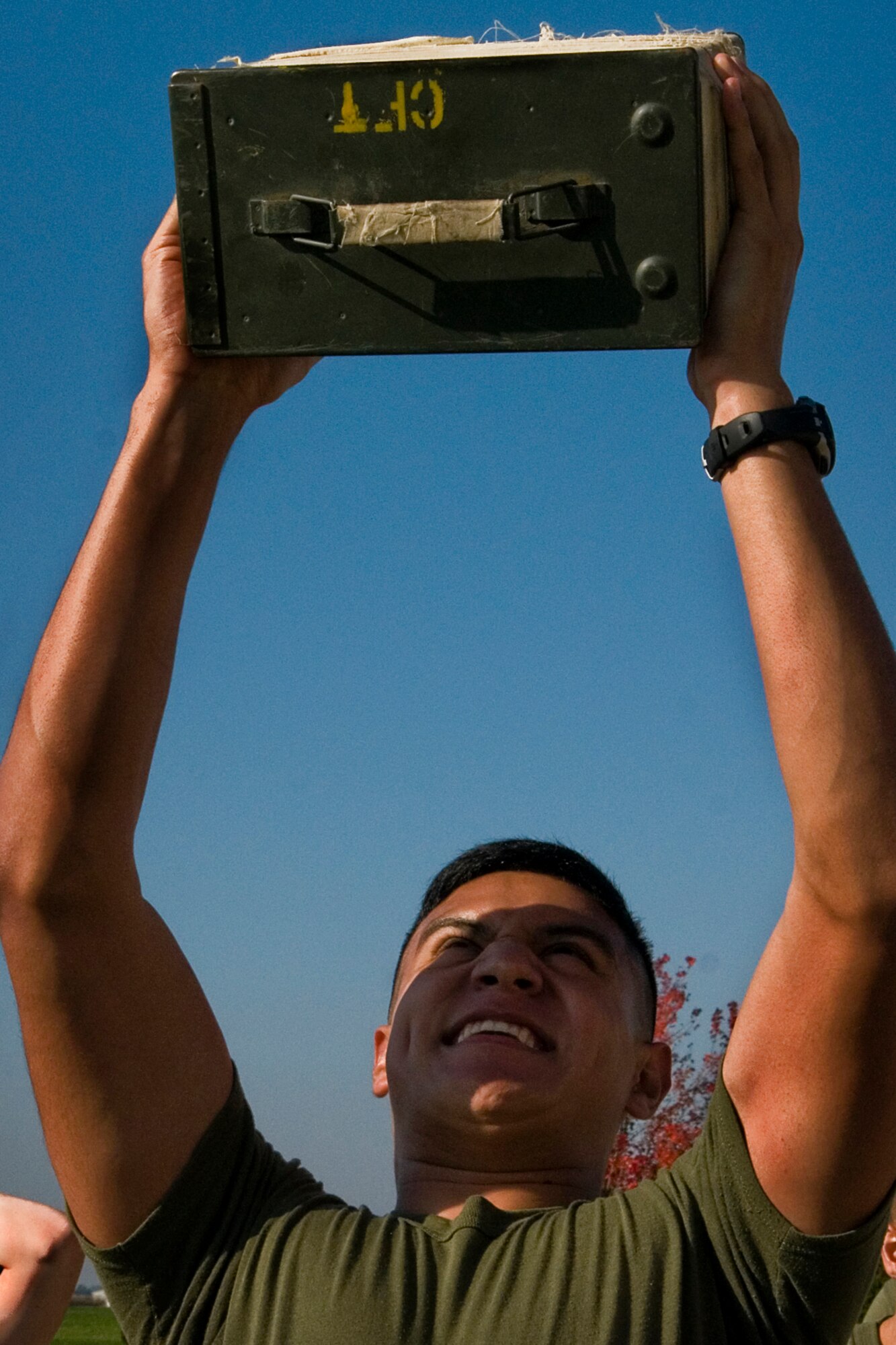 U.S. Marine Corps Lance Cpl. Jonathan Moreno, Detachment 1, Communication Company, Combat Logistics Regiment 45, 4th Marine Logistics Group ground radio repairer, lifts an ammo can over his head, during their annual combat fitness test at Grissom Air Reserve Base, Ind., Oct. 25, 2014. CFTs ensure Marines are capable of conducting combat day-to day operations. (U.S. Air Force photo/Senior Airman Jami K. Lancette)