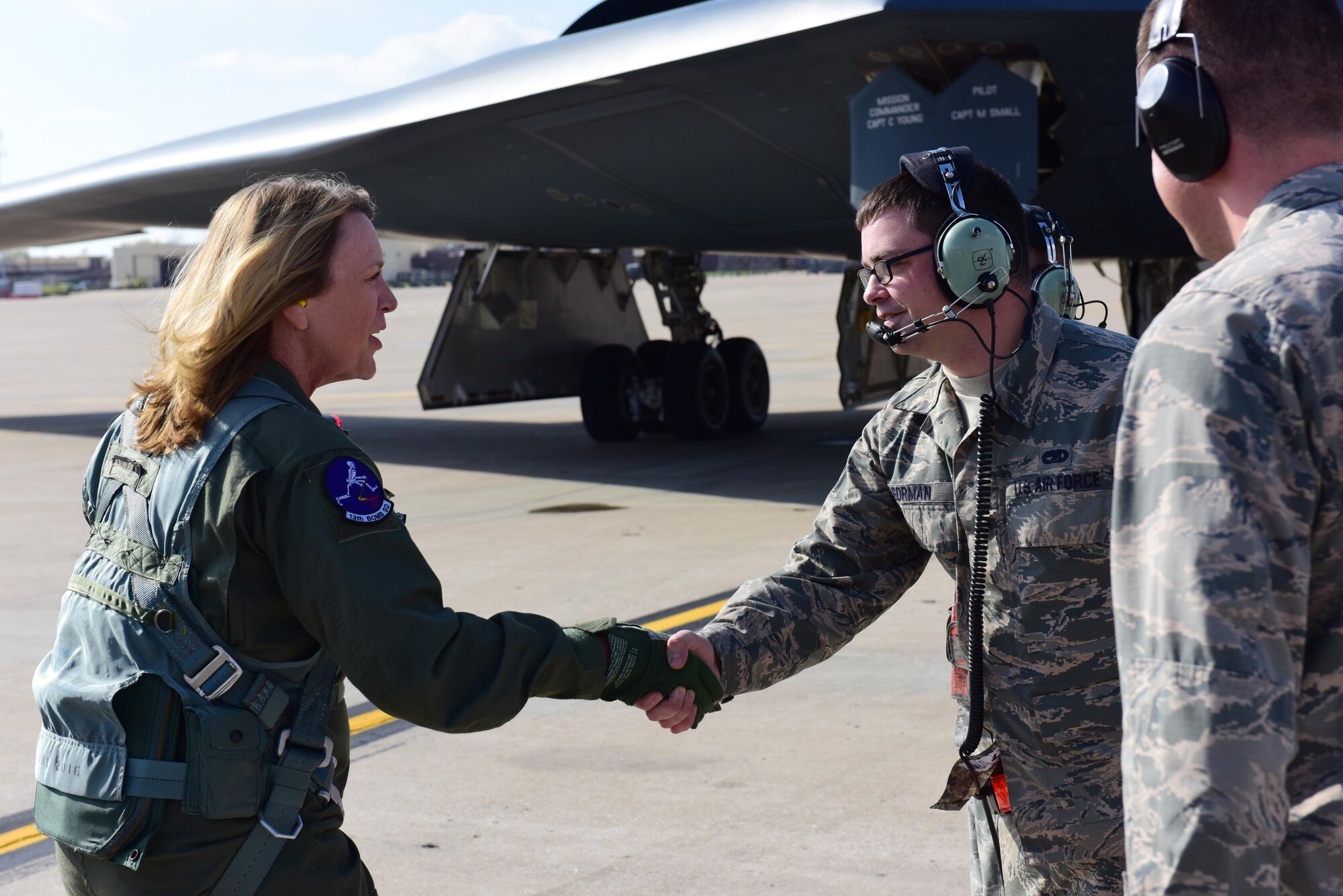 Secretary of the Air Force Deborah Lee James, left, shakes hands with U.S. Air Force Staff Sgt. Tyler Gorman, a crew chief from the 509th Aircraft Maintenance Squadron, before flying in a B-2 Spirit at Whiteman Air Force Base, Mo., Nov. 8, 2016. During James’ visit to Whiteman, she learned more about the wing’s role in strategic deterrence, held an all call, and flew in a B-2 Spirit. (U.S. Air Force photo by Senior Airman Joel Pfiester)