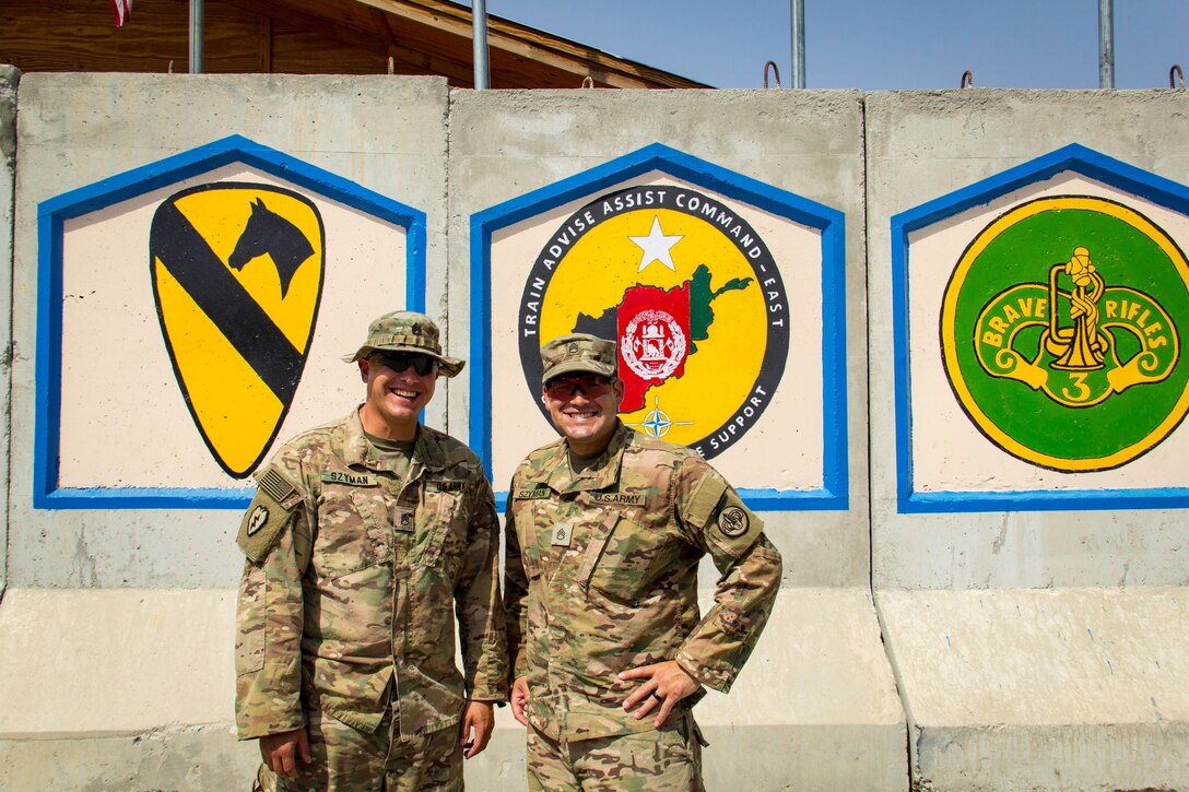 Army Staff Sgt. Mark Szyman, left, and his brother Staff Sgt. Nicholas Szyman are deployed together with the 3rd Cavalry Regiment to the Train, Advise and Assist Command East headquarters in eastern Afghanistan, Sept. 10, 2016. Army photo by Capt. Grace Geiger