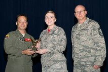 U.S. Air Force Reserve Col. Anthony Brusca, interim commander for the 913th Airlift Group, Senior Airman Ashley Ritchey, 96th Aerial Port Squadron, and Chief Master Sgt. Paul Stewart, superintendent, 913 AG, pose for a photo during Commander’s Call at Little Rock Air Force Base, Ark., Nov. 6, 2016. Ritchey was the 913th Airlift Group’s semi-annual Award Winner in the Airman Category. (U.S. Air Force photo by Master Sgt. Jeff Walston/Released)