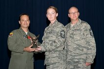 U.S. Air Force Reserve Col. Anthony Brusca, interim commander for the 913th Airlift Group, Senior Master Sgt. Cathryn Rock, 913th Maintenance Squadron, and Chief Master Sgt. Paul Stewart, superintendent, 913 AG, pose for a photo during Commander’s Call at Little Rock Air Force Base, Ark., Nov. 6, 2016. Rock was the 913th Airlift Group’s semi-annual Award Winner in the Senior Noncommissioned Officer Category. (U.S. Air Force photo by Master Sgt. Jeff Walston/Released)