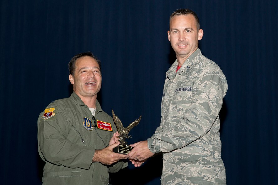 U.S. Air Force Reserve Col. Anthony Brusca, interim commander for the 913th Airlift Group, and 1st Lt. Nick Paladina, 96th Aerial Port Squadron, pose for a photo during Commander’s Call at Little Rock Air Force Base, Ark., Nov. 6, 2016. Paladina was the 913th Airlift Group’s semi-annual Award Winner in the Company Grade Officer Category. (U.S. Air Force photo by Master Sgt. Jeff Walston/Released)