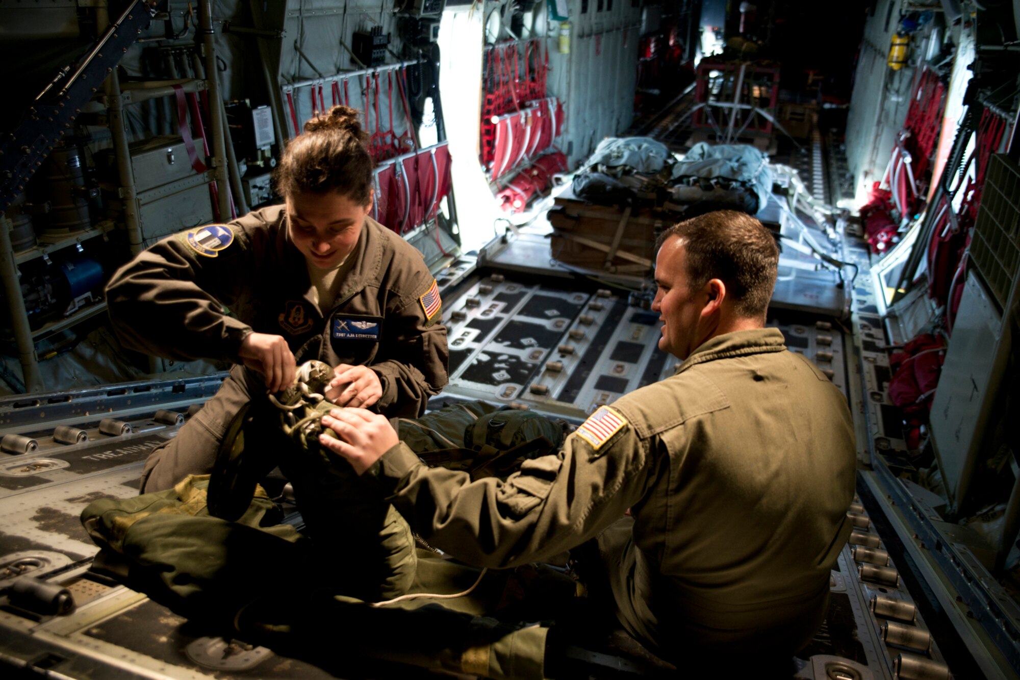 U.S. Air Force Reserve Tech. Sgt. Aja Ledbetter and Master Sgt. James Crawford, loadmasters assigned to the 327th Airlift Squadron, prepare a drogue chute on a C-130J Super Hercules during the Unit Assembly Training weekend, Nov. 5, 2016, at Little Rock Air Force Base, Ark. Training missions on UTA weekends fine tunes Airmen’s skills and prepare them to deploy in support of the Air Force’s worldwide mission. (U.S. Air Force photo by Master Sgt. Jeff Walston/Released)