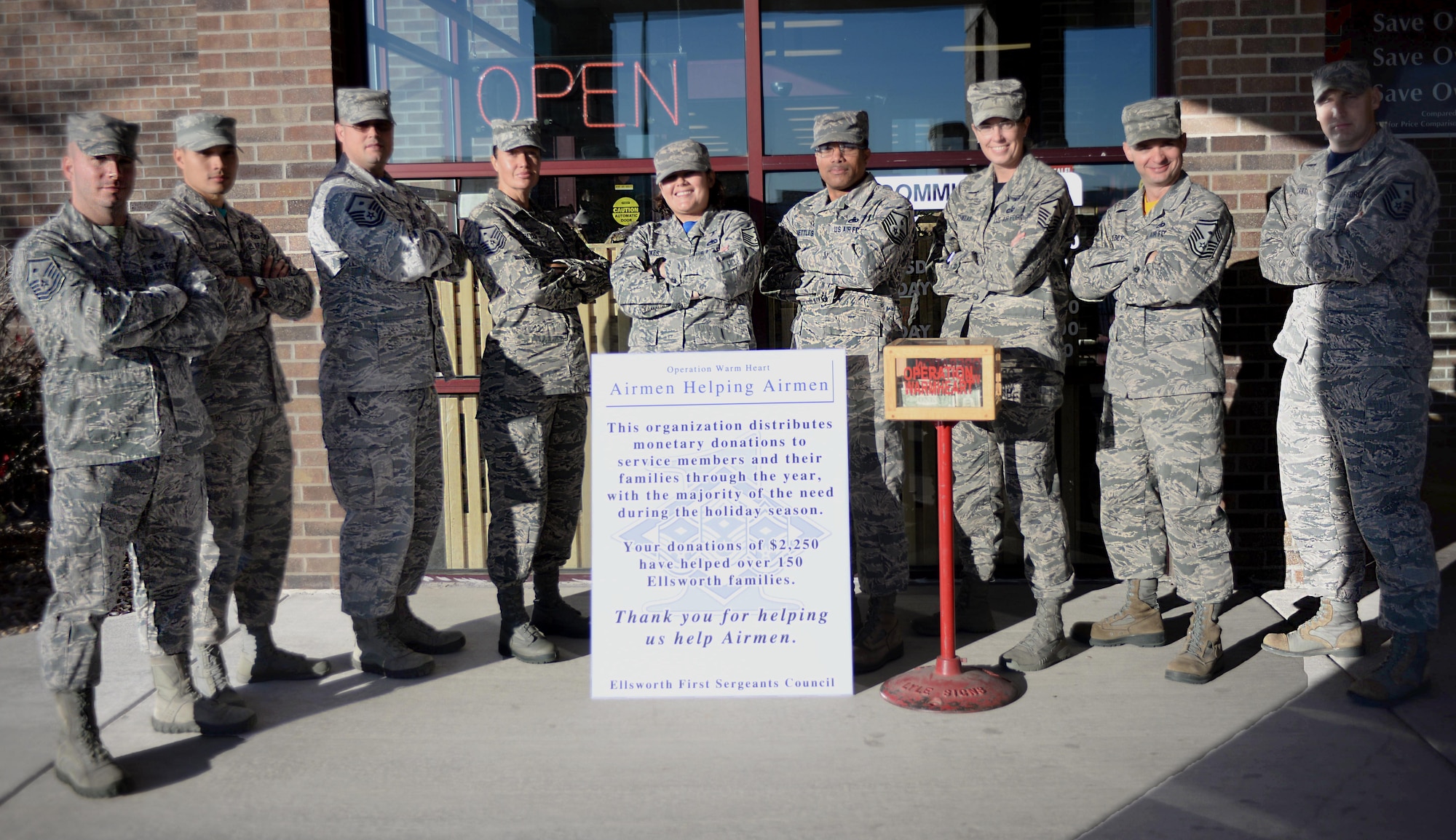 Members of the First Sergeants’ Council stand in front of the Commissary at Ellsworth Air Force Base, S.D., on Nov. 4, 2016. For two weeks, first sergeants took turns ringing a bell in front of the Commissary and accepting donations for Operation Warm Heart, a non-profit program designed to help Airmen in need by providing them Commissary gift cards in time for Thanksgiving.(U.S. Air Force photo by Airman 1st Class Denise M. Jenson)  
