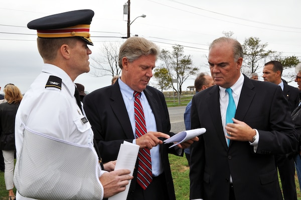 Col. David A. Caldwell, commander, USACE New York District (left), Rep. Frank Pallone (center), and Bob Martin, commissioner, NJDEP (right), discuss plans for Phase 2 of the Hurricane and Storm Damage Reduction Project in Port Monmouth, located in Middletown, N.J.
