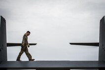 A flight engineer with the 8th Special Operations Squadron conducts pre-flight inspections of a CV-22 Osprey tiltrotor aircraft at Hurlburt Field, Fla., Nov. 8, 2016. Pre-flight inspections are done to check for any issues that may interfere with the flight mission. (U.S. Air Force photo by Airman 1st Class Joseph Pick)
