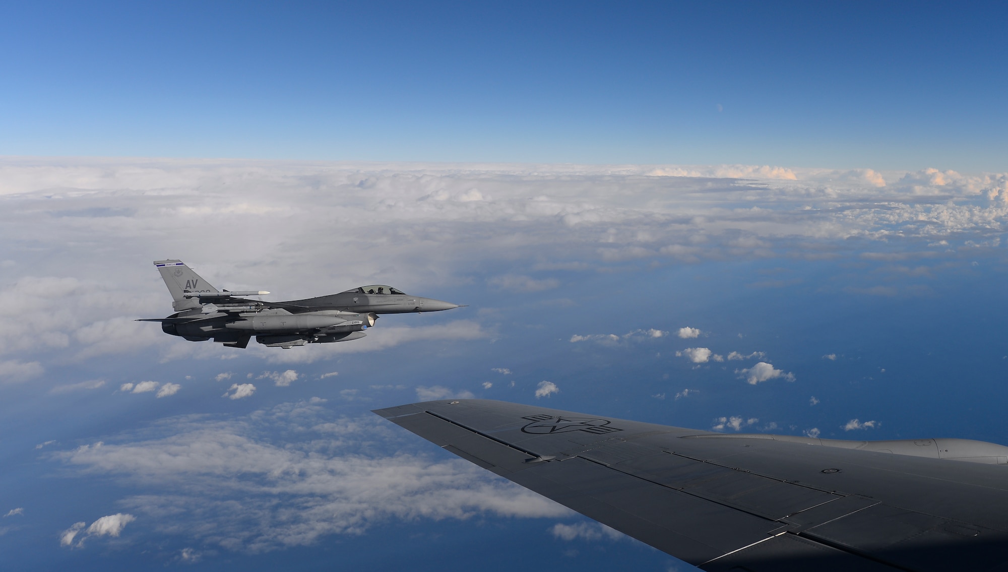 A U.S. Air Force F-16 Fighting Falcon assigned to the 31st Fighter Wing, Aviano Air Base, Italy, flies off the wing of a KC-135 Stratotanker assigned to the 100th Air Refueling Wing, RAF Mildenhall, England, over the Mediterranean Sea during Exercise Tonnerre Lighting Nov. 9, 2016. Exercise Tonnerre Lightning is a NATO exercise designed to improve interoperability between partner nation air forces. (U.S. Air Force photo by Staff Sgt. Micaiah Anthony)