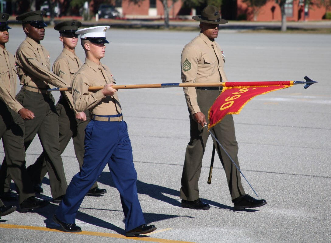 Private First Class Jason P. Gautreaux, honor graduate of platoon 3090, presents his gudon during the pass and review during graduation Nov. 10, 2016, aboard Marine Corps Recruit Depot Parris Island, South Carolina. Gautreaux was recruited out of Recruiting Substation Houma by StaffSgt. Spencer T. Brown. (Official Marine Corps photo by Cpl. Diamond N. Peden/Released)