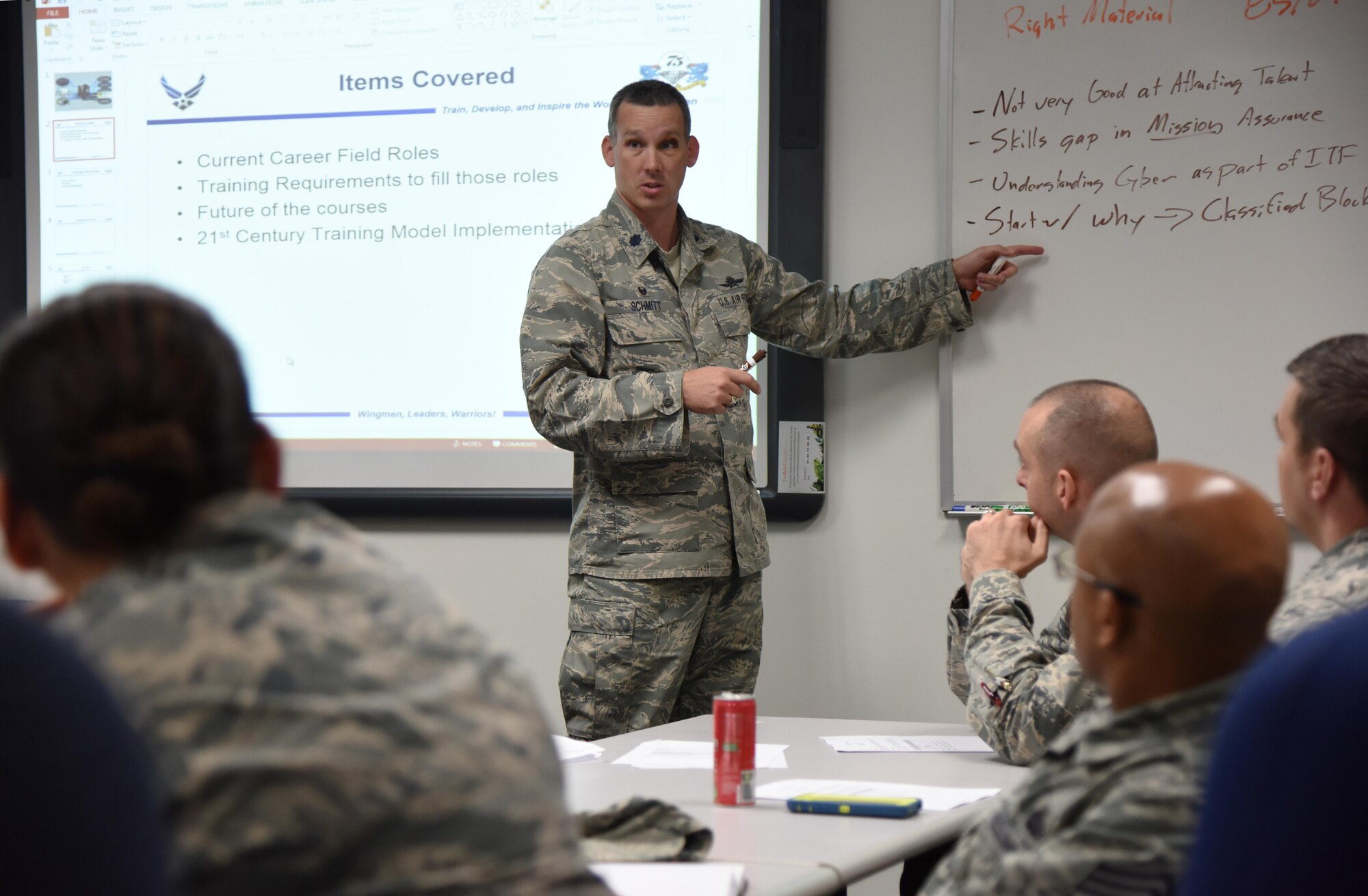 Lt. Col. Daniel Schmitt, 336th Training Squadron commander, briefs attendees during the Cyber Summit at Stennis Hall Nov. 9, 2016, on Keesler Air Force Base, Miss. During the summit there were breakouts where groups discussed the 21st century training model. The three-day summit, hosted by the 81st Training Group, examined the future of the career field’s educational path in the Air Force to include training and workforce development. (U.S. Air Force photo by Kemberly Groue/Released) 