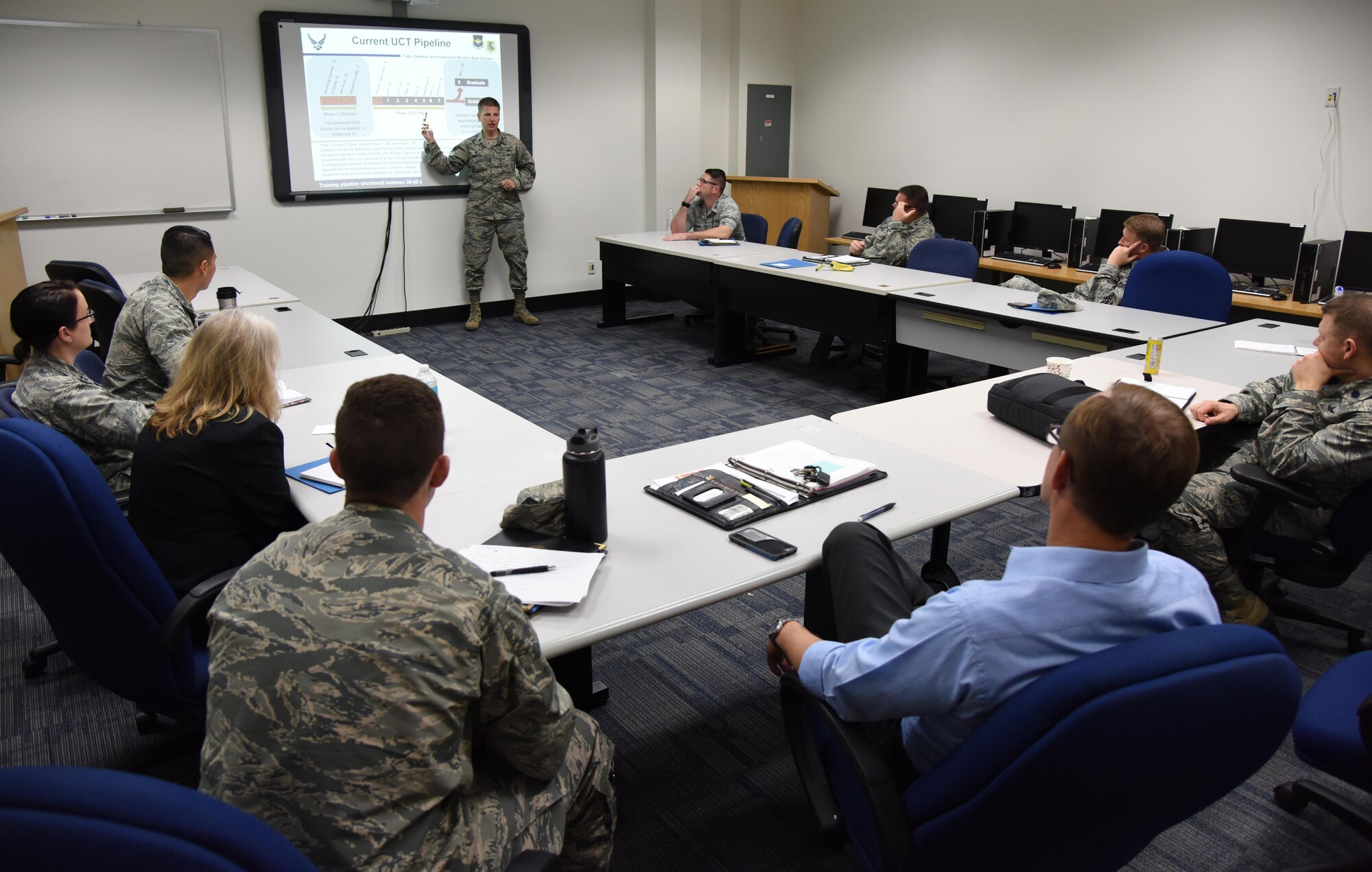 Lt. Col. Nathaniel Huston, 333rd Training Squadron commander, briefs attendees during the Cyber Summit at Stennis Hall Nov. 9, 2016, on Keesler Air Force Base, Miss. During the summit there were breakouts where groups discussed the 21st century training model. The three-day summit, hosted by the 81st Training Group, examined the future of the career field’s educational path in the Air Force to include training and workforce development. (U.S. Air Force photo by Kemberly Groue/Released)