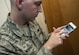 Staff Sgt. Michael Morris, 99th Communications Squadron base content manager, demonstrates how to use the Aviation Nation application that he created for the air show on Nellis Air Force Base, Nev., Nov. 9, 2016. The app has several features and provides up to date information encompassing what is going on during the air show with the ease of it being on a smart phone or tablet. (U.S. Air Force photo by Airman 1st Class Kevin Tanenbaum/Released)