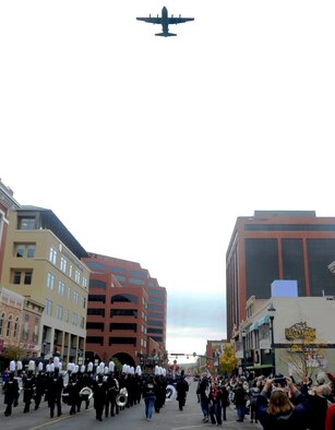 PETERSON AIR FORCE BASE, Colo. -- A C-130 Hercules aircraft assigned to the Air Force Reserve Command's 302nd Airlift Wing, Peterson Air Force Base, Colo., performs a flyover during the Colorado Springs Veterans Day parade in downtown Colorado Springs, Colo., Nov. 5, 2016. This year’s parade theme provided a special honor to Women in the Military. (U.S. Air Force photo/1st Lt.  Stephen Collier)