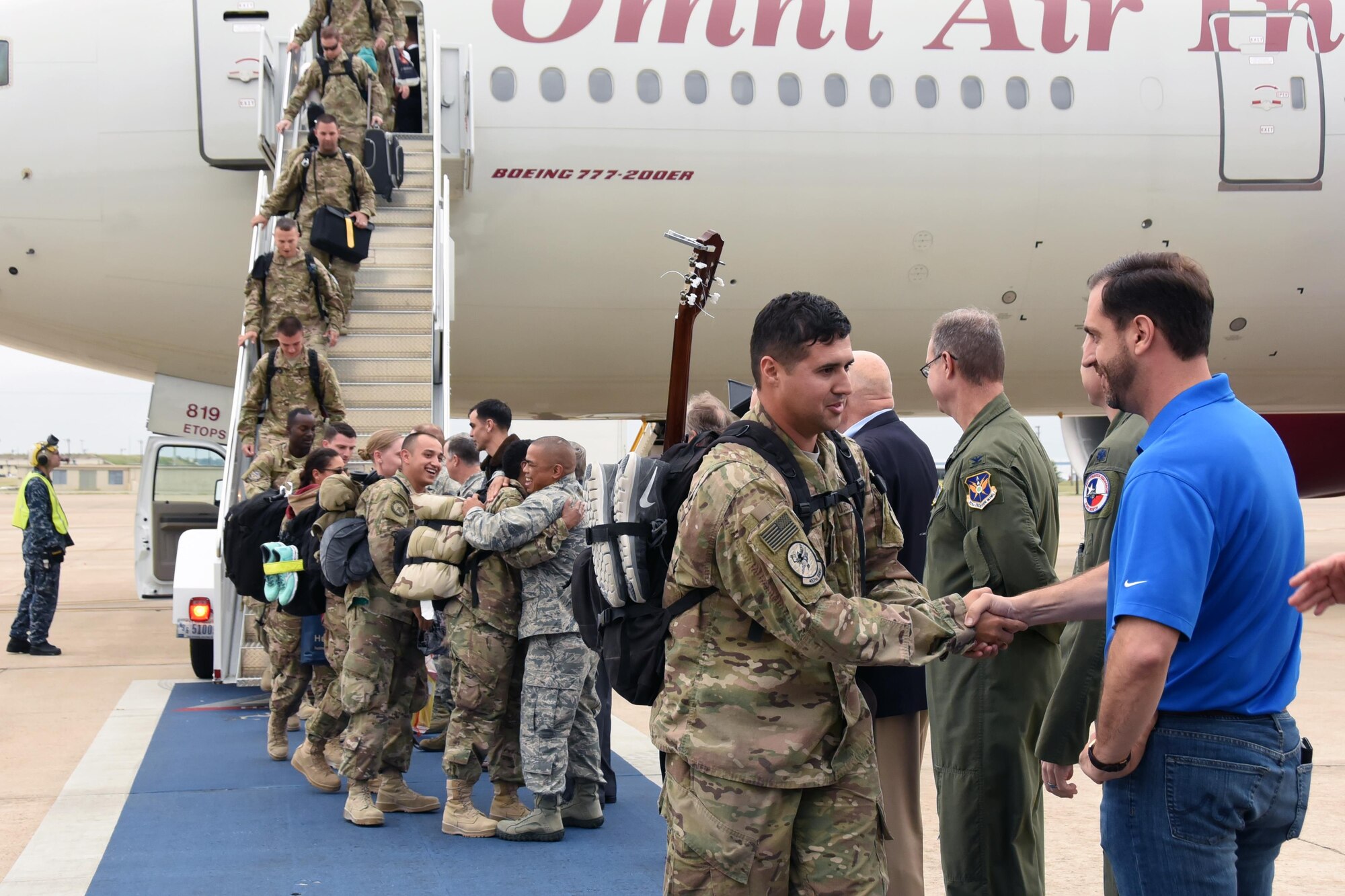 301st Fighter Wing members, families and friends welcome more than 100 Airmen home from Afghanistan Nov. 9, 2016, at Naval Air Station Fort Worth Joint Reserve Base, Texas. Airmen deployed in support of Operation Freedom's Sentinel, which focused on maintaining security and stability in the deployed region. (U.S. Air Force photo by Tech. Sgt. Melissa Harvey)