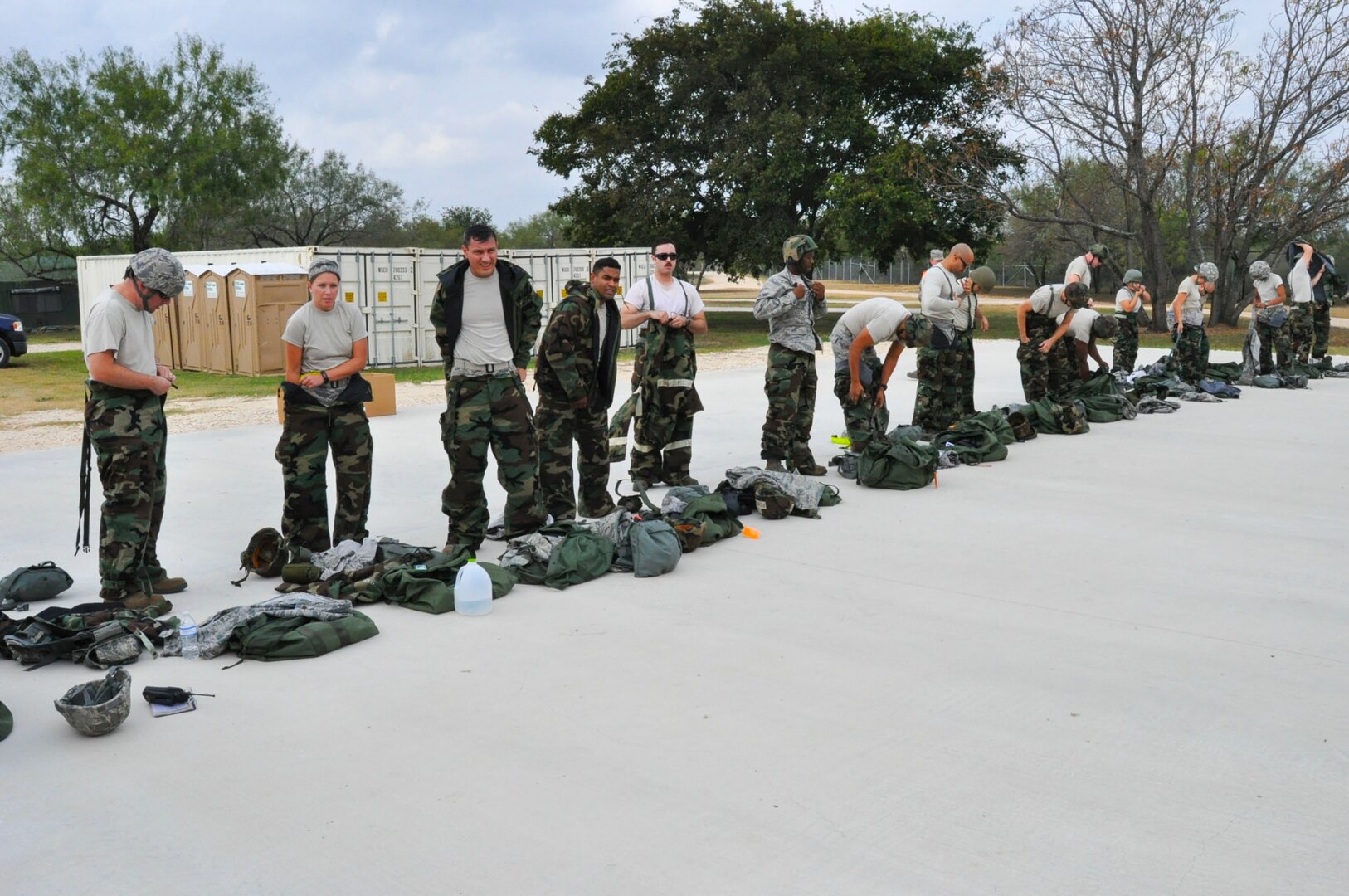 Airmen of the 433rd Airlift Wing don their Mission Oriented Protective Posture gear just before the Steel Thunder exercise Nov. 5, 2016 at Joint Base San Antonio-Lackland. The exercise is designed to test the unit’s responsiveness to a Chemical, Biological, Radiological, Nuclear and high-yield Explosives attack. (U.S. Air Force photo/Senior Airman Bryan Swink)