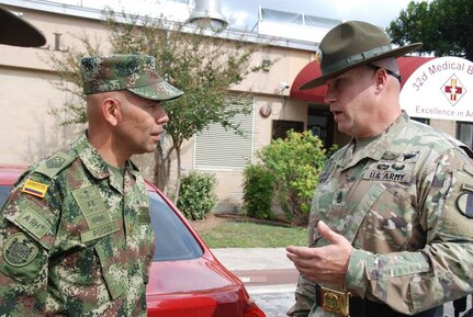 Colombian Sgt. Maj. of the Army Argemiro Posso (left) and Command Sgt. Maj. Charles Gilmore (right), commandant of the United States Army Drill Sergeant Academy, discuss the development of Drill Sergeants during a visit to Joint Base San Antonio-Fort Sam Houston Oct. 25. The visit, hosted by U.S. Army South, supported the Colombian Armies interest in the Drill Sergeant process. 