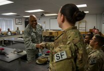 Maj. Gen. Anthony Cotton, 20th Air Force commander, greets an Airman during a weapons course at Minot Air Force Base, N.D., Nov. 8, 2016. The general visited base units over a three-day period, and also helped the 91st Missile Wing celebrate its 68th birthday celebration on Nov. 9. (U.S. Air Force photo/Senior Airman Apryl Hall)