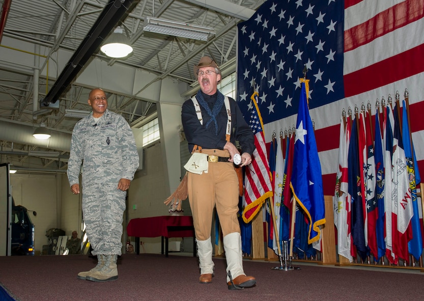 Maj. Gen. Anthony Cotton, 20th Air Force commander, and Dave Larrison, Theodore Roosevelt impersonator, kick off the 91st Missile Wing birthday celebration at Minot Air Force Base, N.D., Nov. 9, 2016. The event featured a speech from Cotton and a cake-cutting ceremony. (U.S. Air Force photos/Senior Airman Apryl Hall)