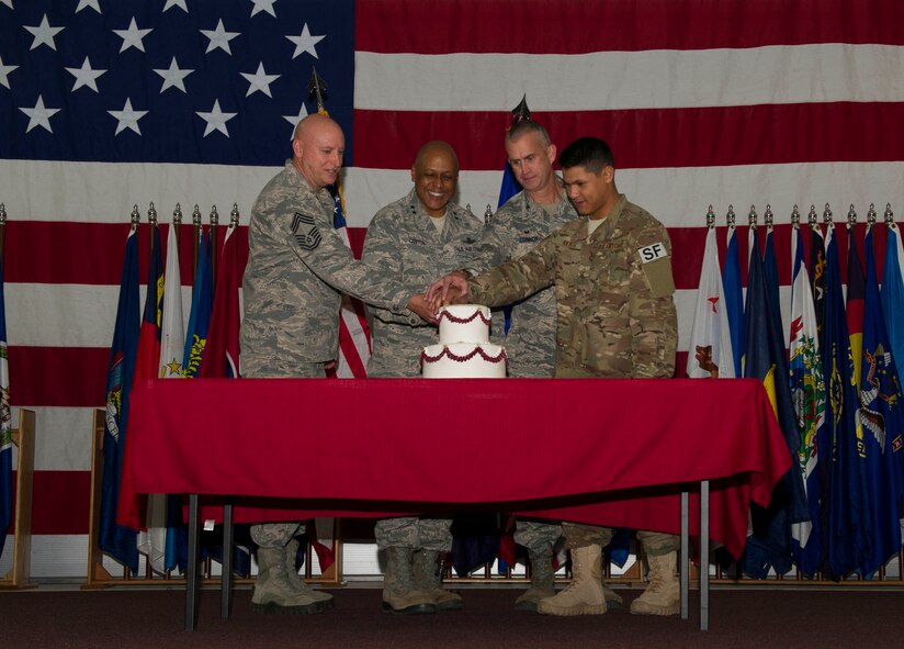 Maj. Gen. Anthony Cotton, 20th Air Force commander, and Col. Colin Connor, 91st Missile Wing commander, cut the 91MW birthday cake with the wing’s oldest and youngest Airmen at Minot Air Force Base, N.D., Nov. 9, 2016. The event celebrated the wing’s 68th year in service. (U.S. Air Force photos/Senior Airman Apryl Hall)