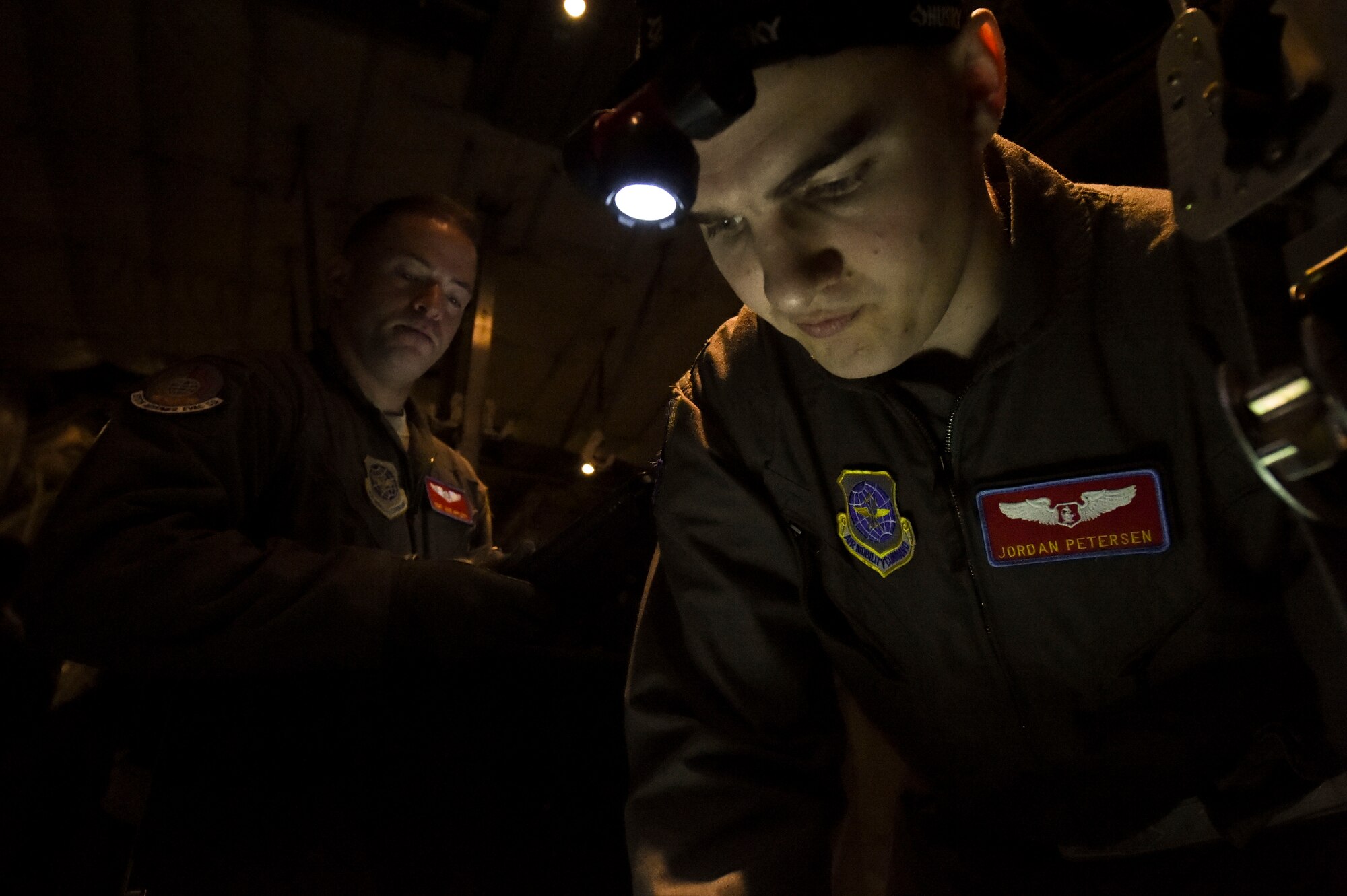 (From left) U.S. Air Force Tech. Sgt. Jacob Appleby, 375th Aeromedical Evacuation Squadron air evacuation technician, watches as U.S. Air Force Capt. Jordan Petersen, 375th AES flight nurse, performs pre-flight checks during exercise Tropical Storm Greg, Nov. 8, 2016, at Little Rock Air Force Base, Ark. The exercise was an example of how the U.S. Air Force provides support to local, state and federal authorities by continuing to play a prominent role in devising the strategies employed. (U.S. Air Force photo by Senior Airman Stephanie Serrano)