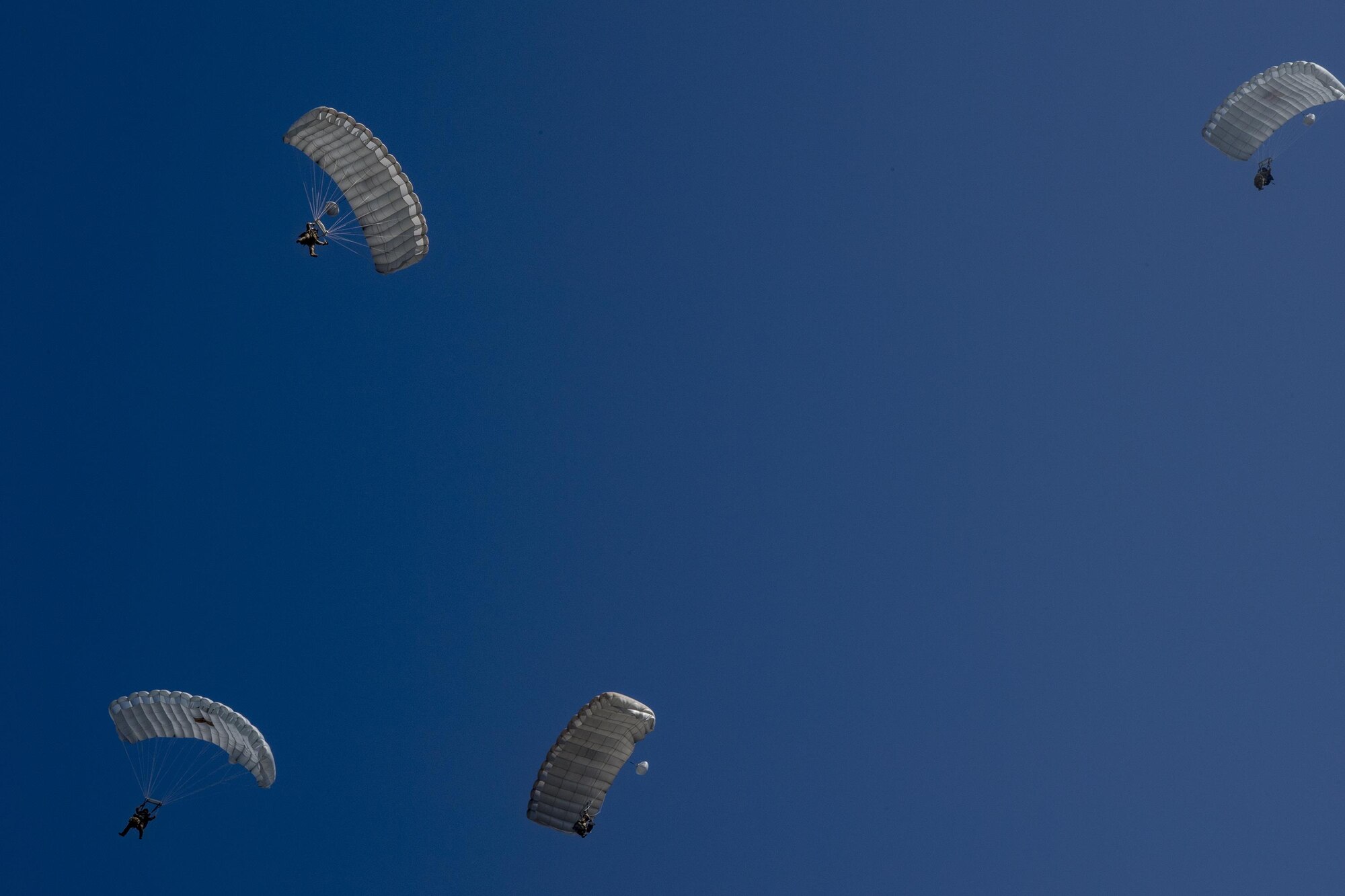 Pararescuemen from the 38th Rescue Squadron parachute towards the ground during a rapid-rescue exercise, Nov. 2, 2016, in Marianna, Fla. The exercise was designed to test the 347th Rescue Group’s ability to rapidly deploy, plan and execute rescue operations in combat environments. The exercise included HC-130J Combat King IIs, HH-60G Pave Hawks, C-17 Globemaster IIIs, A-10C Thunderbolt IIs, E-8C Joint Stars, pararescuemen and maintenance, intelligence and support personnel. (U.S. Air Force photo by Tech. Sgt. Zachary Wolf)