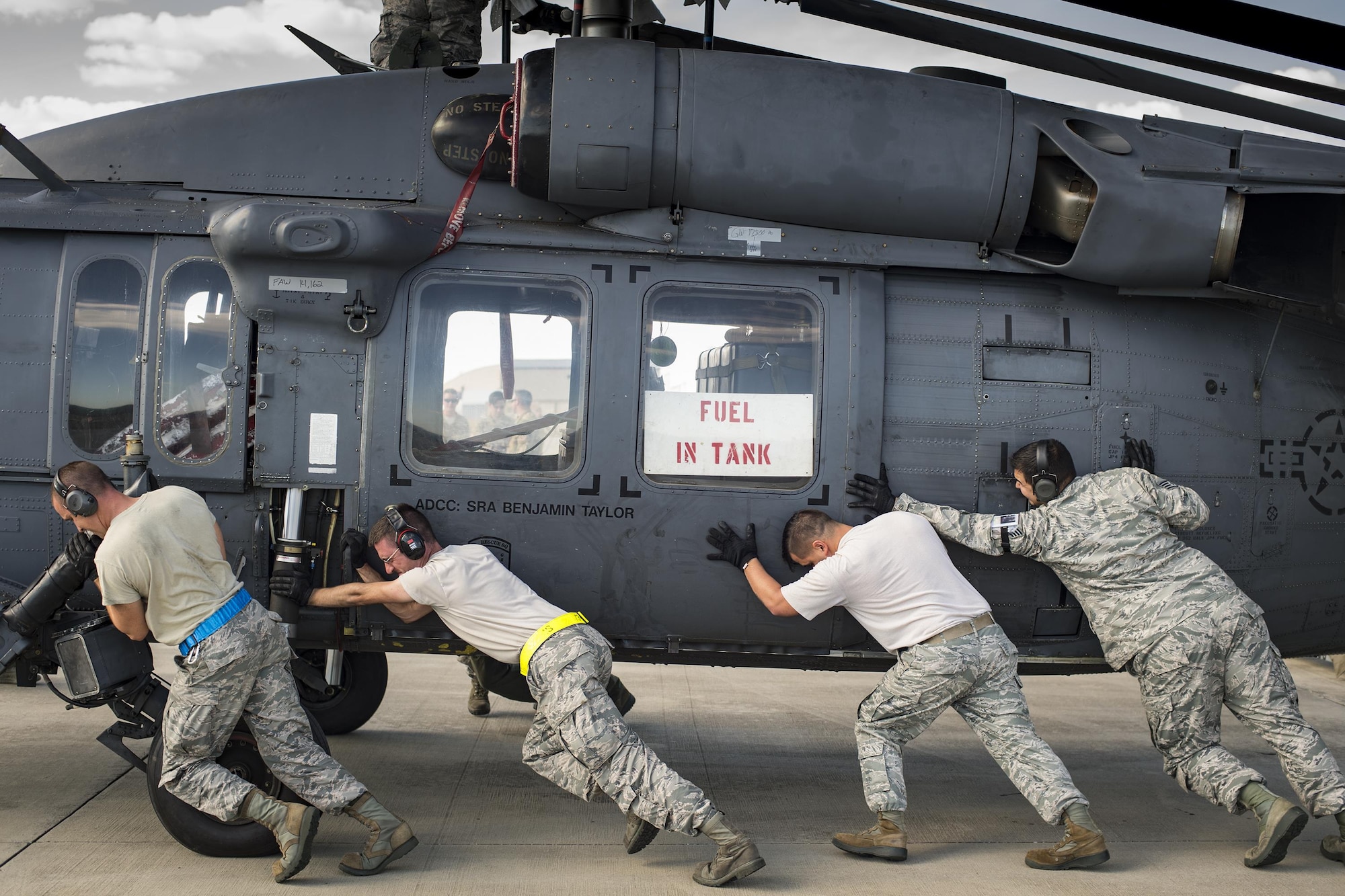 Airmen from the 41st Helicopter Maintenance Unit and the 325th Logistics Readiness Squadron unload an HH-60G Pave Hawk, assigned to the 41st Rescue Squadron, from a C-17 Globemaster III, during a rapid-rescue exercise, Nov. 1, 2016, at Tyndall Air Force Base, Fla. The first stage of the exercise tested Moody’s ability to quickly deploy rescue aircraft and personnel to an austere environment. (U.S. Air Force photo by Staff Sgt. Ryan Callaghan)

