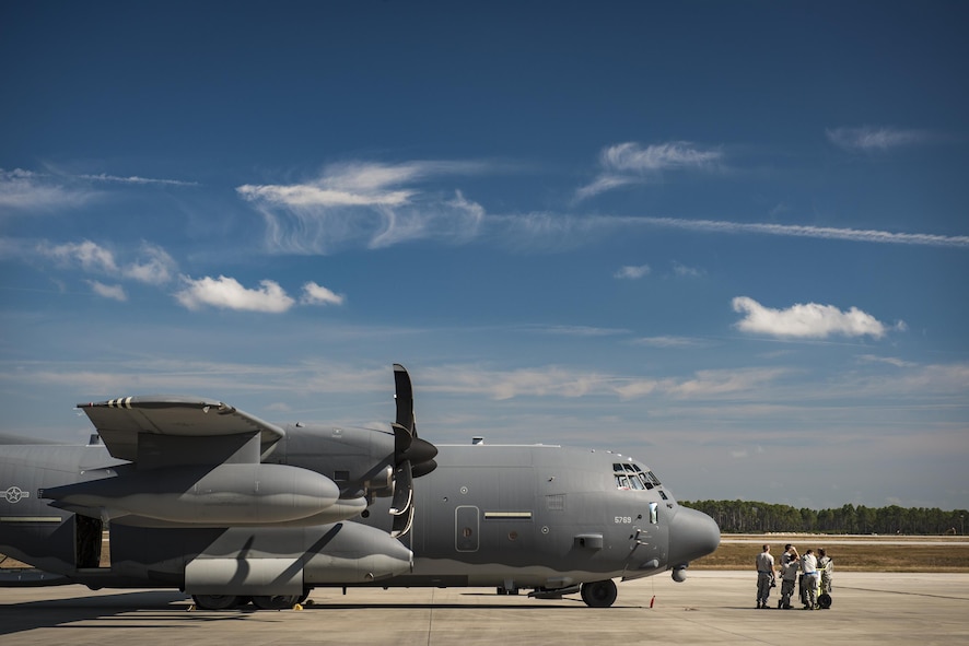 Airmen from the 71st Aircraft Maintenance Unit wait in front of an HC-130J Combat King II for a mission to kick-off during a rapid-rescue exercise, Nov. 2, 2016, at Tyndall Air Force Base, Fla. The exercise was designed to test the 347th Rescue Group’s ability to rapidly deploy, plan and execute rescue operations in combat environments. The exercise included HC-130J Combat King IIs, HH-60G Pave Hawks, C-17 Globemaster IIIs, A-10C Thunderbolt IIs, E-8C Joint Stars, pararescuemen and maintenance, intelligence and support personnel. (U.S. Air Force photo by Staff Sgt. Ryan Callaghan)
