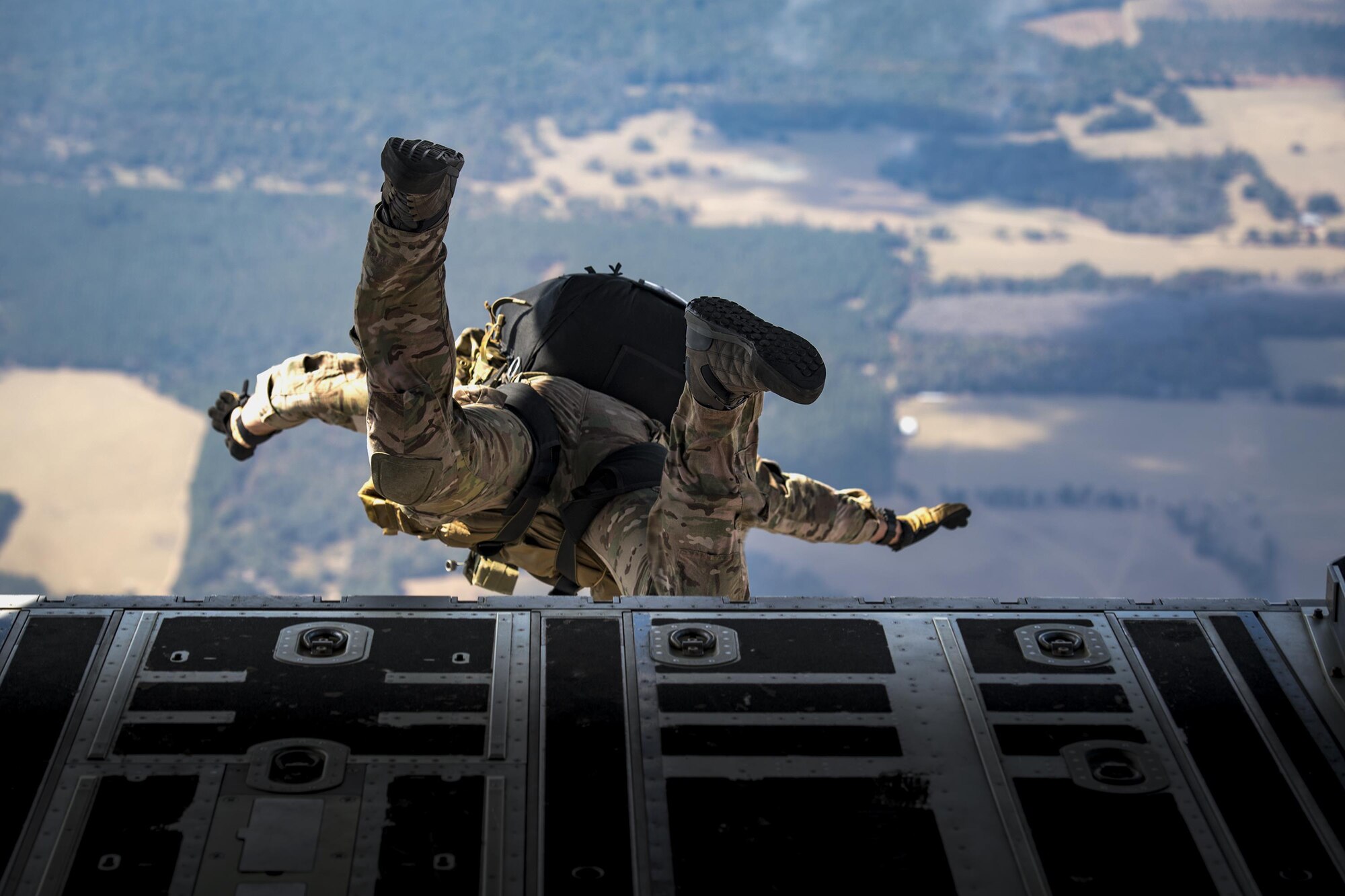 A pararescueman from the 38th Rescue Squadron jumps from an HC-130J Combat King II during a rapid-rescue exercise, Nov. 2, 2016, in the skies over Marianna, Fla. The exercise was designed to test the 347th Rescue Group’s ability to rapidly deploy, plan and execute rescue operations in combat environments. The exercise included HC-130J Combat King IIs, HH-60G Pave Hawks, C-17 Globemaster IIIs, A-10C Thunderbolt IIs, E-8C Joint Stars, pararescuemen and maintenance, intelligence and support personnel. (U.S. Air Force photo by Staff Sgt. Ryan Callaghan)