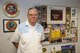 U.S. Air Force retired Chief Master Sgt. Garland “Bill” Love poses in front of memorabilia at the Retiree Activities Office at Davis-Monthan Air Force Base, Ariz., Nov. 7, 2016. Love served 32 years in the Air Force, 16 years in the civil services and is now on his 13th year of service at D-M’s Retiree Activities Office on base. (U.S. Air Force photo by Airman 1st Class Mya M. Crosby)