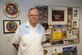 U.S. Air Force retired Chief Master Sgt. Garland “Bill” Love poses in front of memorabilia at the Retiree Activities Office at Davis-Monthan Air Force Base, Ariz., Nov. 7, 2016. Love served 32 years in the Air Force, 16 years in the civil services and is now on his 13th year of service at D-M’s Retiree Activities Office on base. (U.S. Air Force photo by Airman 1st Class Mya M. Crosby)