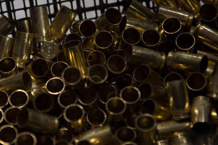 Brass bullet casings sit in a bin during the 2nd Annual Excellence in Competition, on Joint Base Andrews, Md., Nov. 8, 2016. Service members were broken into relays to allow everyone who signed up the chance to participate and test their marksmanship, with each member shooting 30 rounds from a Beretta M9 pistol. Targets were scored by combat arms instructors, and then compared to determine the best marksman. (U.S. Air Force photo by Senior Airman Mariah Haddenham)