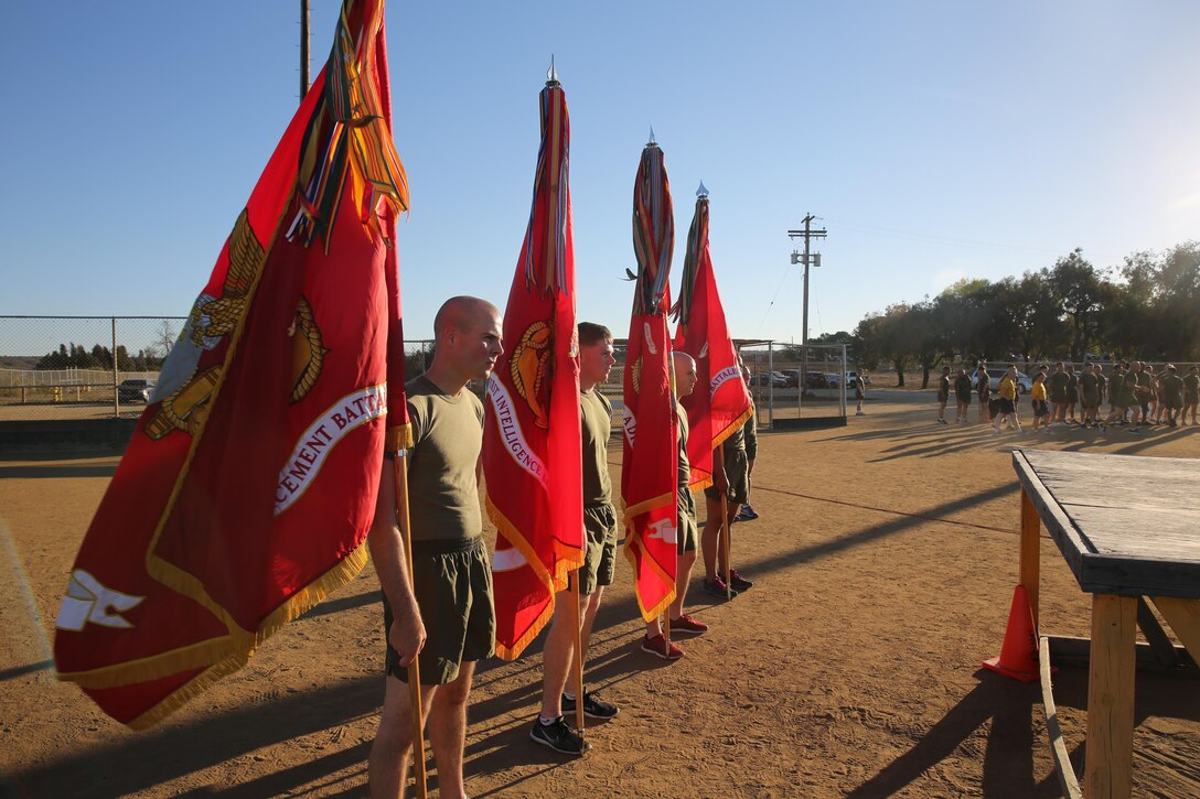 Marines with the I Marine Expeditionary Force Headquarters Group bear their unit’s standards after a motivational run at Marine Corps Base Camp Pendleton, Calif., Nov. 10, 2016. The run was done in celebration of the 241st birthday of the United States Marine Corps. On Nov. 1, 1921, General John A. Lejeune, 13th Commandant of the Marine Corps, directed that Marines throughout the globe would celebrate their traditions on the Marine Corps Birthday, Nov. 10.  (U.S. Marine Corps photo by Pfc. Robert Bliss)