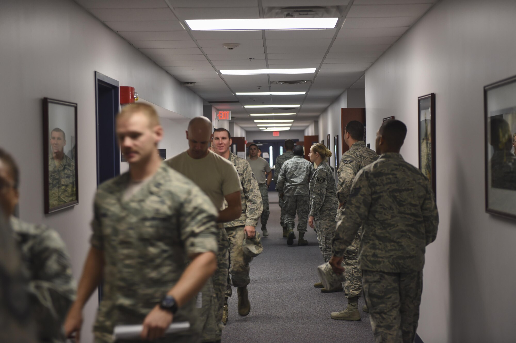 Members of Joint Base Charleston stand in line to receive their annual flu vaccine at a point of distribution during a public health emergency exercise on Joint Base Charleston, South Carolina, Nov. 9, 2016. The 628th MDG administered flu vaccinations during the exercise. In the event of a real world incident, members would be given a flu vaccine if they had not already received one, as well as medication to combat the outbreak. To simulate that, those who participated in the exercise were given the vaccination and candy to represent medication.